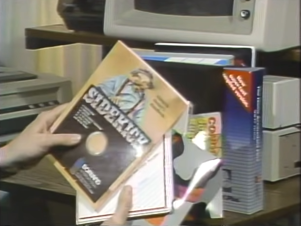 Wendy Woods holding a random assortment of IBM Personal Computer software.