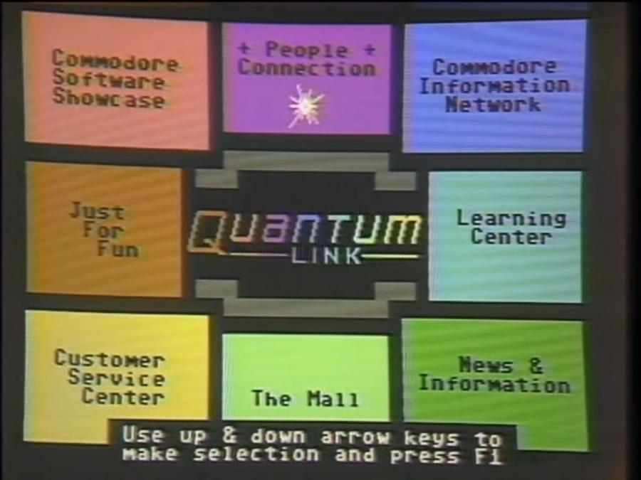 The main menu for “Quantum Link,” an online service for Commodore 64 users that debuted in November 1985. There is a Quantum Link logo in the center of the screen, which is surrounded by eight colored squares in a grid pattern. Each square has a different menu option. Starting from the top left and going clockwise, the options are: Commodore Software Showcase, People Connection, Commodore Information Network, Learning Center, News & Information, The Mall, Customer Service Center, and Just for Fun