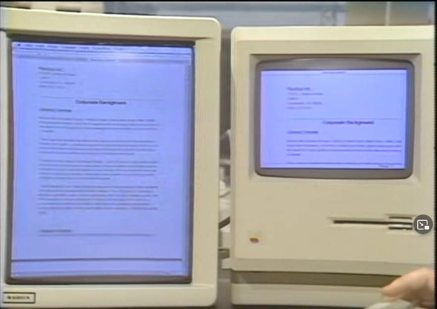 A Radius Full Page Display sitting next to a Macintosh 512K computer on a desk. There is a full 8.5-by-11 inch document displayed on the Radius, and a smaller portion of that same document displayed on the Macintosh screen.